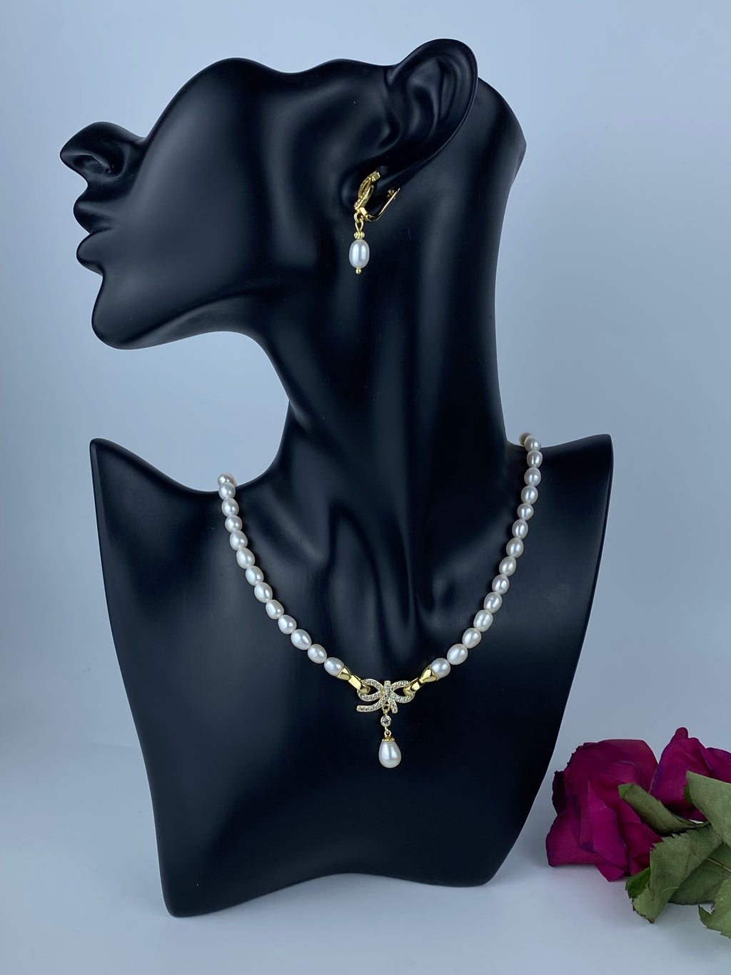 Chic Bridal Natural Smooth Rice Pearl Necklace with 18k Gold Plated Crystal Bow Pendant, Matching 18k Gold Plated earrings.Complete Bridal Set.